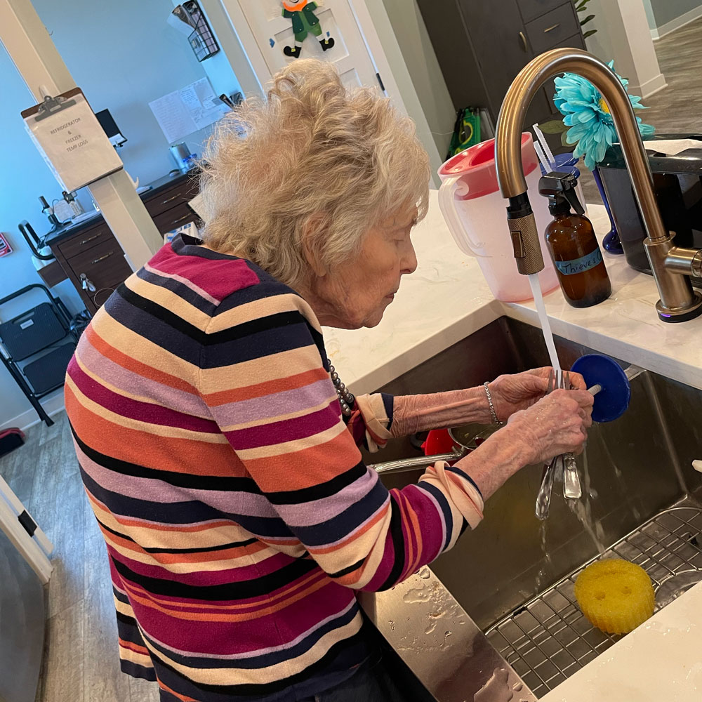 RSL Memory Care of New Berlin, WI doing dishes